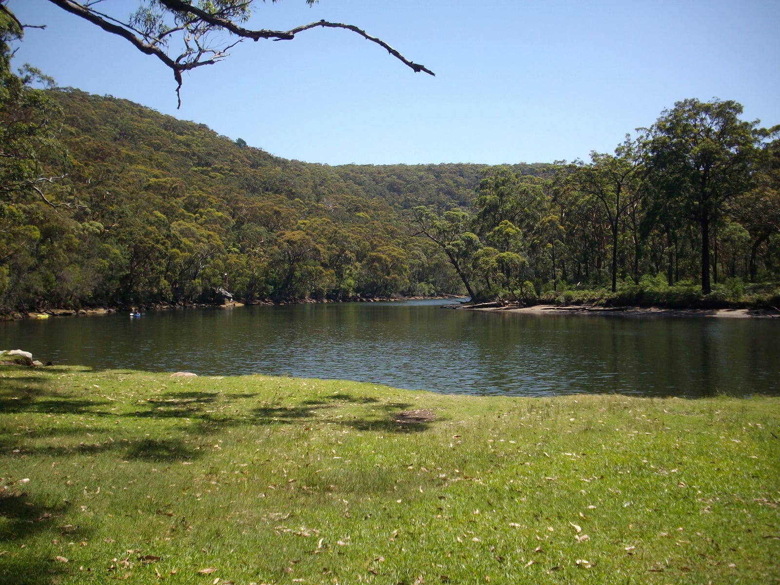 Peaceful view of a picnic spot next to river and bushland in Australia