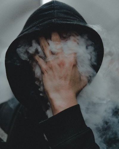 Photo of shadowy independent figure by Jaroslav Devia on Unsplash